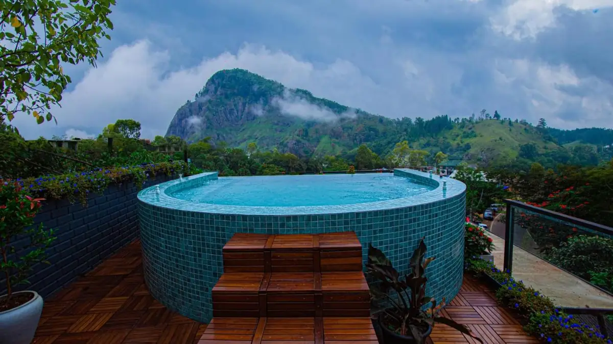 Round pool on the terrace at Ella Heritage, with Ella Rock in the background